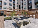 Coveted outdoor space includes two furnished and landscaped courtyards with lounge seating, BBQ and dining areas, firepits, a bar with a television, and a Zen relaxation area. 