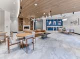 Upscale amenities include a resident lounge, co-working spaces, a smart package room, covered parking with electric car charging stations, bicycle storage, and a complimentary resident shuttle to the Grove Street PATH station.