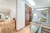 Entryway featuring custom walnut built-ins.