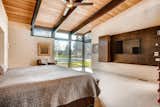 Bedroom, Shelves, Bed, and Ceiling Lighting  Photo 18 of 25 in Rural Refinement by Virtuance Real Estate Photography