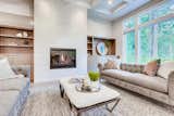 Gas burning fireplace with built-in shelves. 