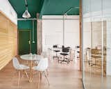 Office, Chair, Laminate Floor, and Desk Lobby and employees meeting point.  Photo 8 of 10 in Office renovation in an industrial building of Poblenou district. by estudio CO-A