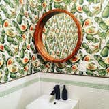 Charley St. restaurant bathroom with avocado print wallpaper