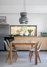 Dining Room, Porcelain Tile Floor, Pendant Lighting, and Table The dining table that grandpa built  Photo 7 of 9 in PB Mod by architects magnus