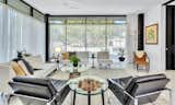 Interior view of steel-framed home with floor-to-ceiling glass.