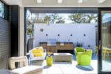 The home opens to the courtyard with seamless indoor-outdoor living.