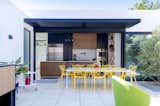 The kitchen opens to the outdoor dining with seamless indoor-outdoor living.