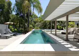 Lap pool with covered outdoor patio