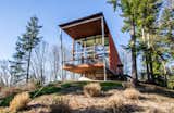 Exterior The residence has an elongated, open-plan interior layout.   Photo 2 of 8 in A Cantilevered Bainbridge Island Home Set Atop a Historic Bunker Lists For $1.73M from Stunning Steel-Frame Construction Cantilevered atop Historic Bunker For Sale