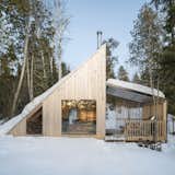 Montreal firm L’Abri reinterpreted the classic A-frame to create a secluded shelter just north of Ottawa, Canada, in Poisson Blanc Regional Park. The serene cabin provides space for up to four guests. The exterior is clad in natural cedar board that will silver over the years, allowing the structure to blend into its forested site.