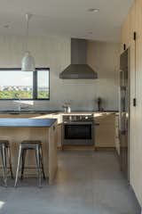 kitchen window frames the view of Boise's city skyline