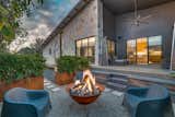 Outdoor, Trees, Concrete Patio, Porch, Deck, Hardscapes, Side Yard, Raised Planters, Walkways, Gardens, Decking Patio, Porch, Deck, and Wood Patio, Porch, Deck Chilling by the Fire  Photo 2 of 11 in Jete by Cliff Graham