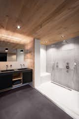 Bath Room, Concrete Counter, Concrete Floor, Drop In Sink, Wall Lighting, Ceiling Lighting, Open Shower, One Piece Toilet, Drop In Tub, and Concrete Wall  Photo 3 of 9 in Monastery House by Bureau Fraai