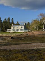 Exterior, Wood Siding Material, Stone Siding Material, Gable RoofLine, Metal Roof Material, and House Building Type View from tidal flats  Photo 1 of 13 in Bay of Fundy house by Paul French