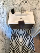Powder bath Hex tiles by Cle. Wallpaper by Anthropologie.   Search “Anthropologie” from The Heights