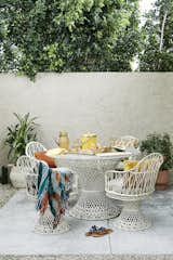 Outdoor, Small Patio, Porch, Deck, Shrubs, Trees, Desert, and Side Yard This small corner of the backyard was transformed into a chic boho entertaining dining space.  Photo 7 of 20 in Desert Glam by Colossus Mfg.