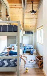 This bunk room isn't for kids only. Boasting four twin beds and a secret hiding space in the rafters above, this could very well be the kids favorite room, maybe ours too.