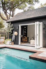 Shed & Studio and Living Space Room Type Edge of the textured pool leads right up to the sliding doors of pool house, which can be used as a guest house!  Photo 9 of 11 in Tudor Noir by Colossus Mfg.