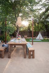 Natural materials, faux-grass, and easy cleaning granite create the perfect space for play, and entertaining with a Palm Springs/Mediterranean vibe.  Photo 3 of 8 in East Sacramento Backyard by Colossus Mfg.