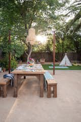 Natural materials, faux-grass, and easy cleaning granite create the perfect space for play, and entertaining with a Palm Springs/Mediterranean vibe.