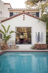 Our Spanish vibe inspired pool is what summer dreams are made of, with rattan furniture and intricate tile surrounding the pool.