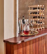 Dining Room and Bar Built in marble dry bar with cherry wood table top.  Photo 5 of 13 in New Old World by Colossus Mfg.