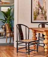 Vintage black and gold dining chairs pop against this custom built dining table.
