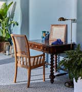 Antique cherry writing desk and chair gets lots of natural light in this blue on blue sun room.
