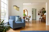 Living Room, Ceiling Lighting, Chair, Medium Hardwood Floor, and Rug Floor Knoll fabric gave this client's newly reupholstered "tea chair" some new life, while creating a cozy area the flows into the dining room.  Photo 3 of 21 in Bright Harmony by Colossus Mfg.