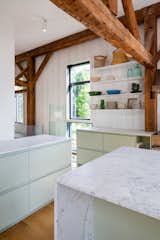 Kitchen, Range, Colorful, Range Hood, Drop In, Wood, Marble, Ceiling, Recessed, and Medium Hardwood  Kitchen Range Ceiling Range Hood Marble Drop In Medium Hardwood Photos from The Barn