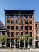 Exterior view of the heritage building where the loft is located. This facade of Old Montreal is in brick and Saint-Marc stone.