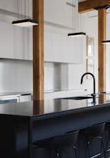 Ceiling lighting : Systemalux / Pendant lighting : Lambert & fils / Granit countertops : Stone age / Stainless counter top : Solufab / Cabinetry : Atelier 13 - custom design by La Firme / Stools : Lattitude Nord