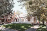 A quaint white stucco home in Denver, CO. 