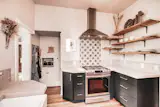 Beautiful kitchen in Denver, CO with open shelving and updated appliances. 