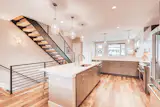  A modern kitchen with an island - townhome in Denver, CO. 