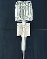 The horizontal and vertical grout joints intersect at the centerlines of this wall sconce accentuating the sconce.  The grout joints are 1/16" for a flawless look.  