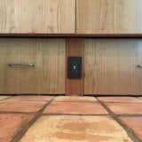 The Baseboards are taller to align with the height of the hearth and turned into EXTRA STORAGE DRAWERS.  The client loved this idea for it's cleaner lines and extra space.  Also, an opportunity for a tucked away plug as not to destroy her much desired existing saltillo floor tile.  