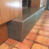 Cabinets wrap around hearth perfectly.
