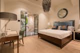 Courtyard guest suite  looks out to Pebble, glass and moss mosaic wall 