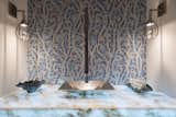 Entry Powder Room with vine mosaic tile,  white bronze sink & glowing counter 