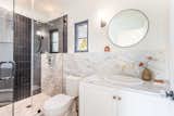 Well-equipped powder room includes shower
