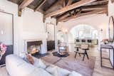 View the wood-burning fireplace from luxurious custom kitchen