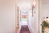 Hall leads to master suite and guest rooms