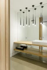 Bath Room, Wood Counter, Pendant Lighting, and Concrete Floor  Photo 18 of 24 in Lac-Brome house by Cyr Cathcart interior designers