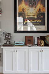 Custom cabinetry by McKinney Homes holds additional film treasures and houses Stephen’s Indiana Jones collection of a 1981 Italian subway poster, film scripts and movie relics from Steven Spielberg’s iconic action/adventure series.