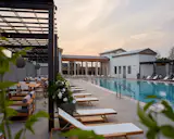 Renowned architect Keith Summerour’s latest design can be seen at Pinewood Forest, the new urbanist community for storytellers and creatives located steps from Pinewood Atlanta Film Studios. 

Solea, Latin for horseshoe, is inspired by the Weir on the River Avon in Bath, England. With classic Greco-Roman architecture, our pool is designed to create the illusion of a river overflowing its banks in an Old World European village. 
