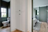 Hallway and Light Hardwood Floor Hall bathroom and storage  Photo 10 of 15 in Pinewood Forest Anders Cottage by Emily