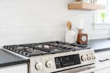 Stainless steel Bosch appliances are a highlight in this kitchen.