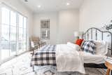 Bedroom, Bed, Chair, Night Stands, and Recessed Lighting Master on main opens to private courtyard perfect for drinking coffee in the mornings or a glass of wine at night.  Photo 8 of 12 in Glasgow Terrace Home - A Haven for Storytellers and Creatives by Emily