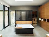 Master bathroom, bathtub in front of custom perforated steel privacy screen